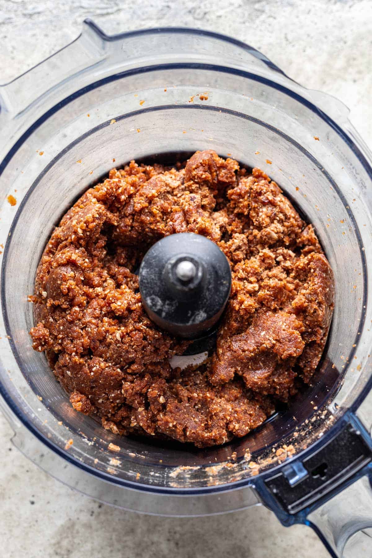 Pumpkin bliss ball mixture in a food processor.