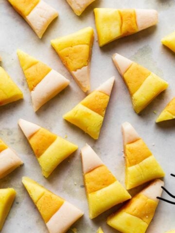Homemade candy corn on a white backdrop.