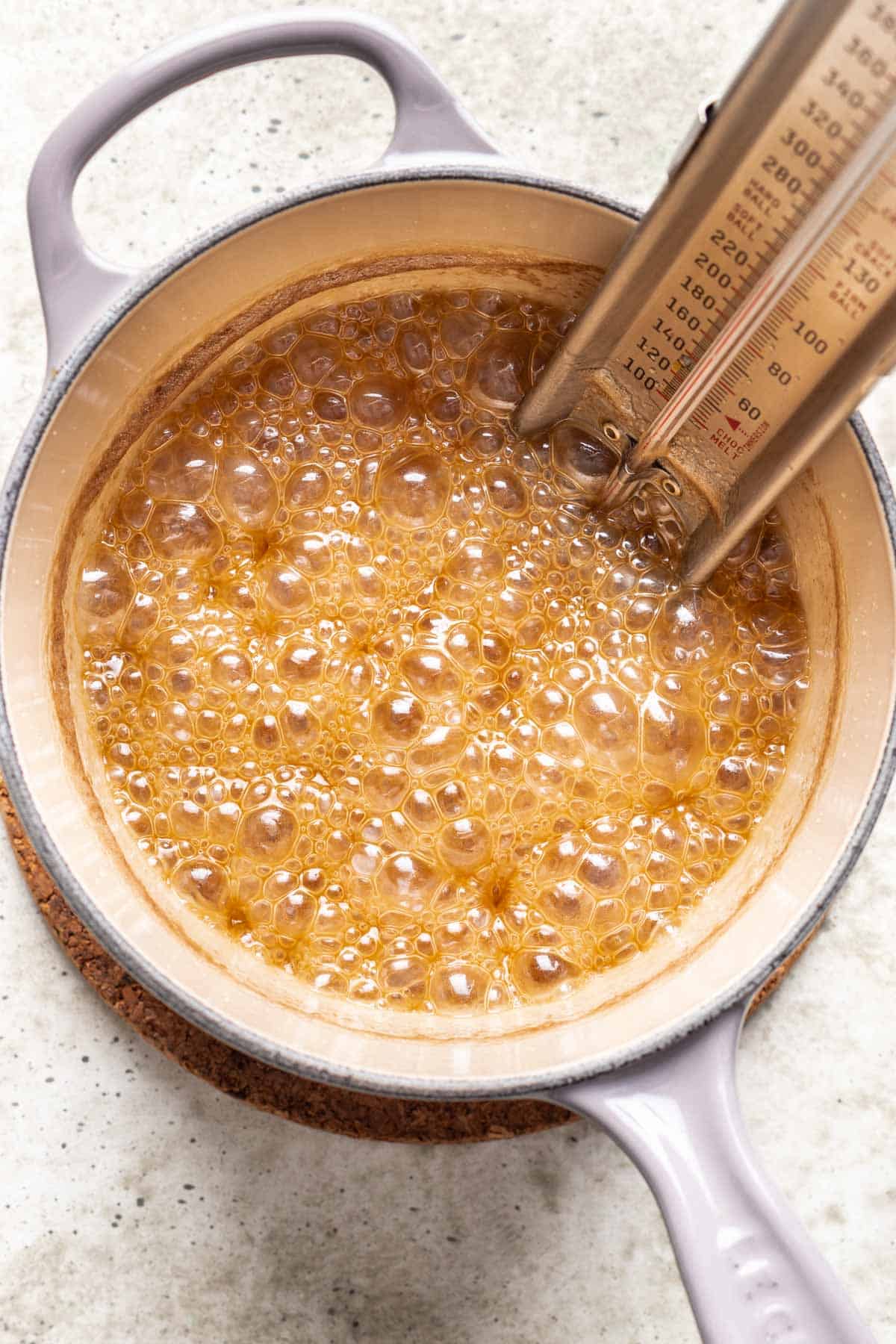 Wet ingredients cooked and bubbling in a small saucepan.