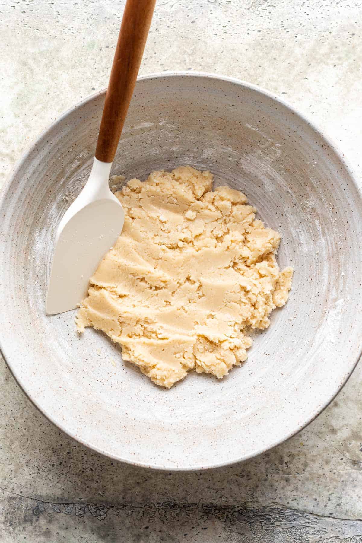 Candy corn dough mixed in a large bowl.
