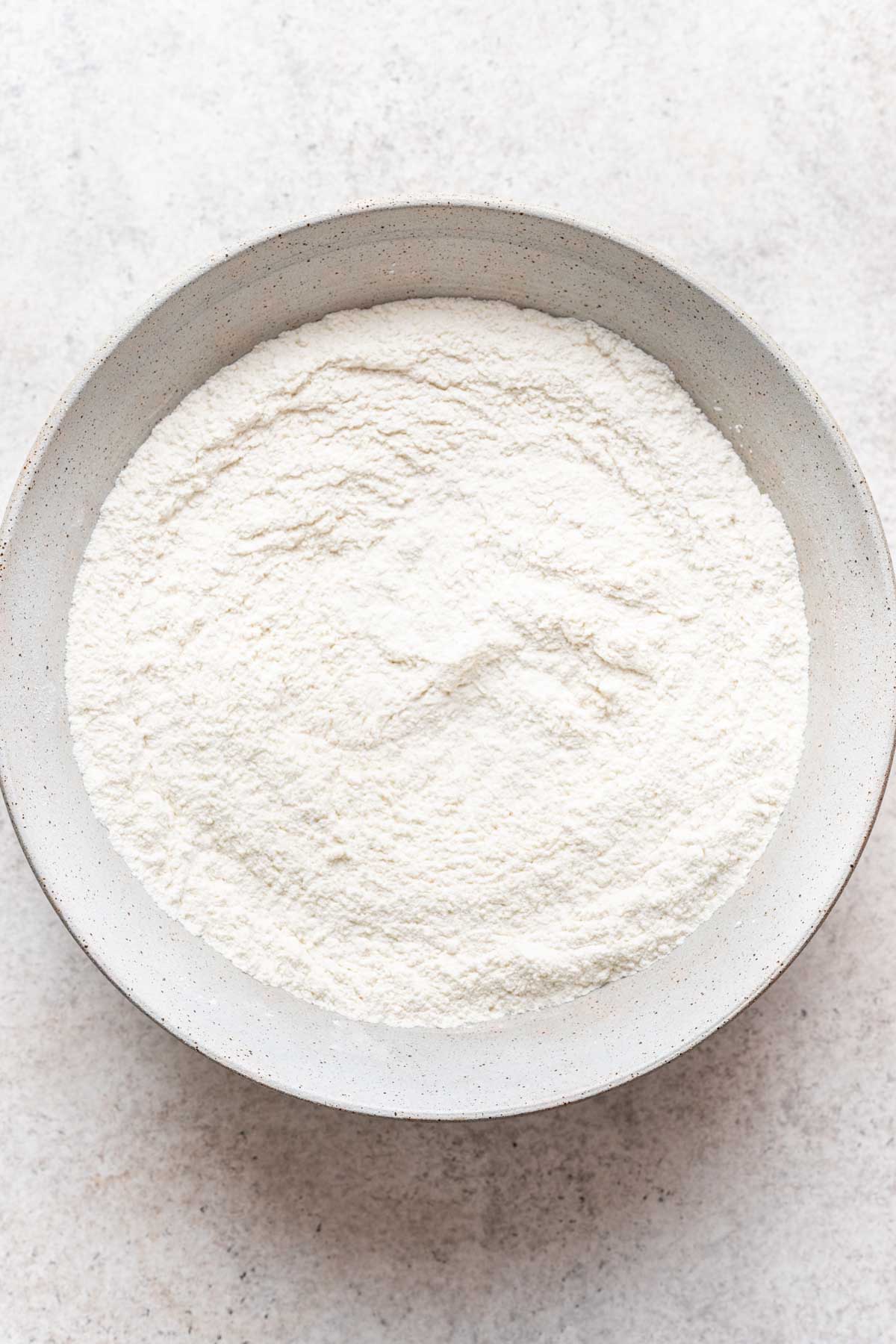 Dry ingredients whisked together in a bowl.