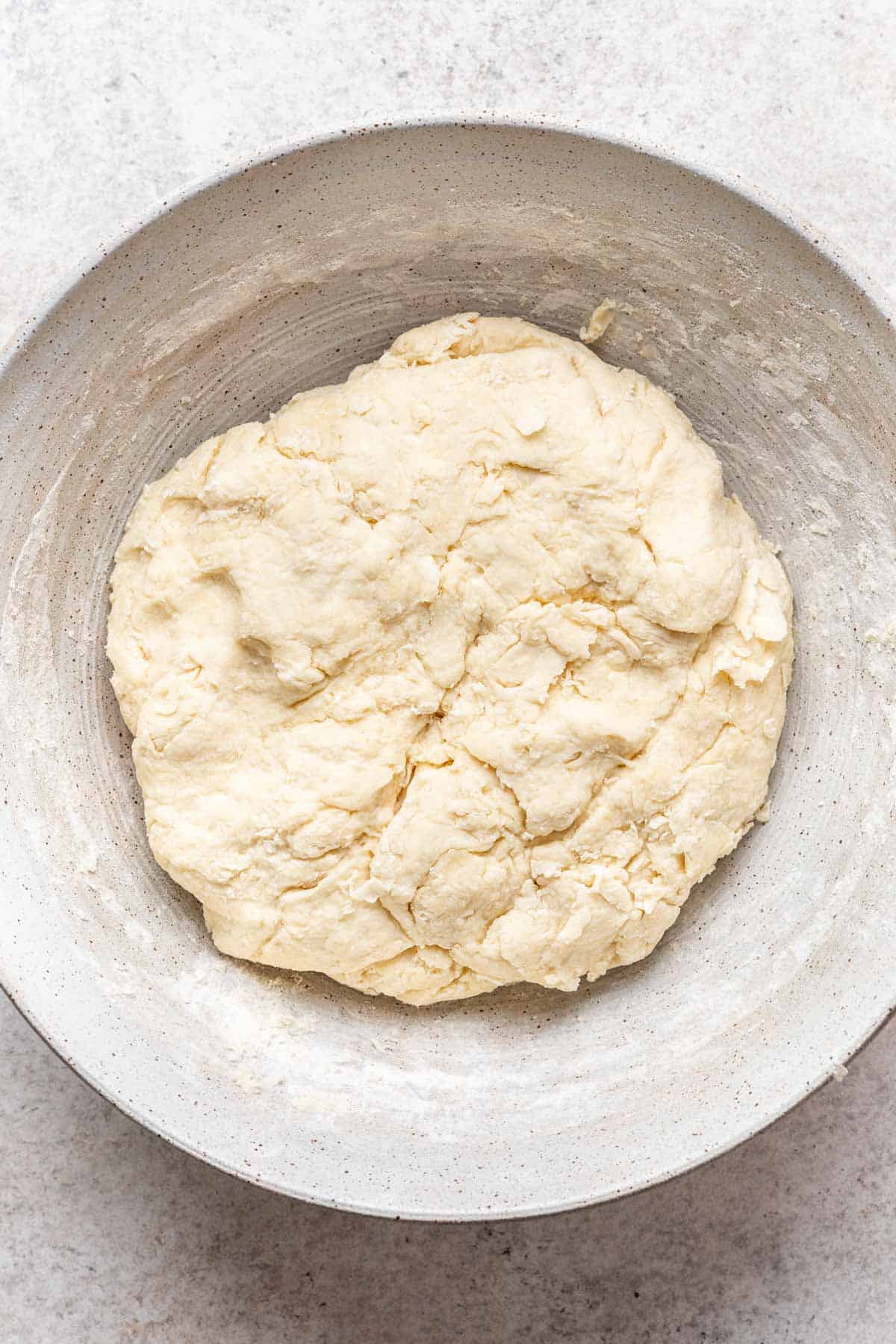 Homemade biscuit dough in a bowl.