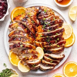 Sliced honey baked turkey breast on a serving platter.
