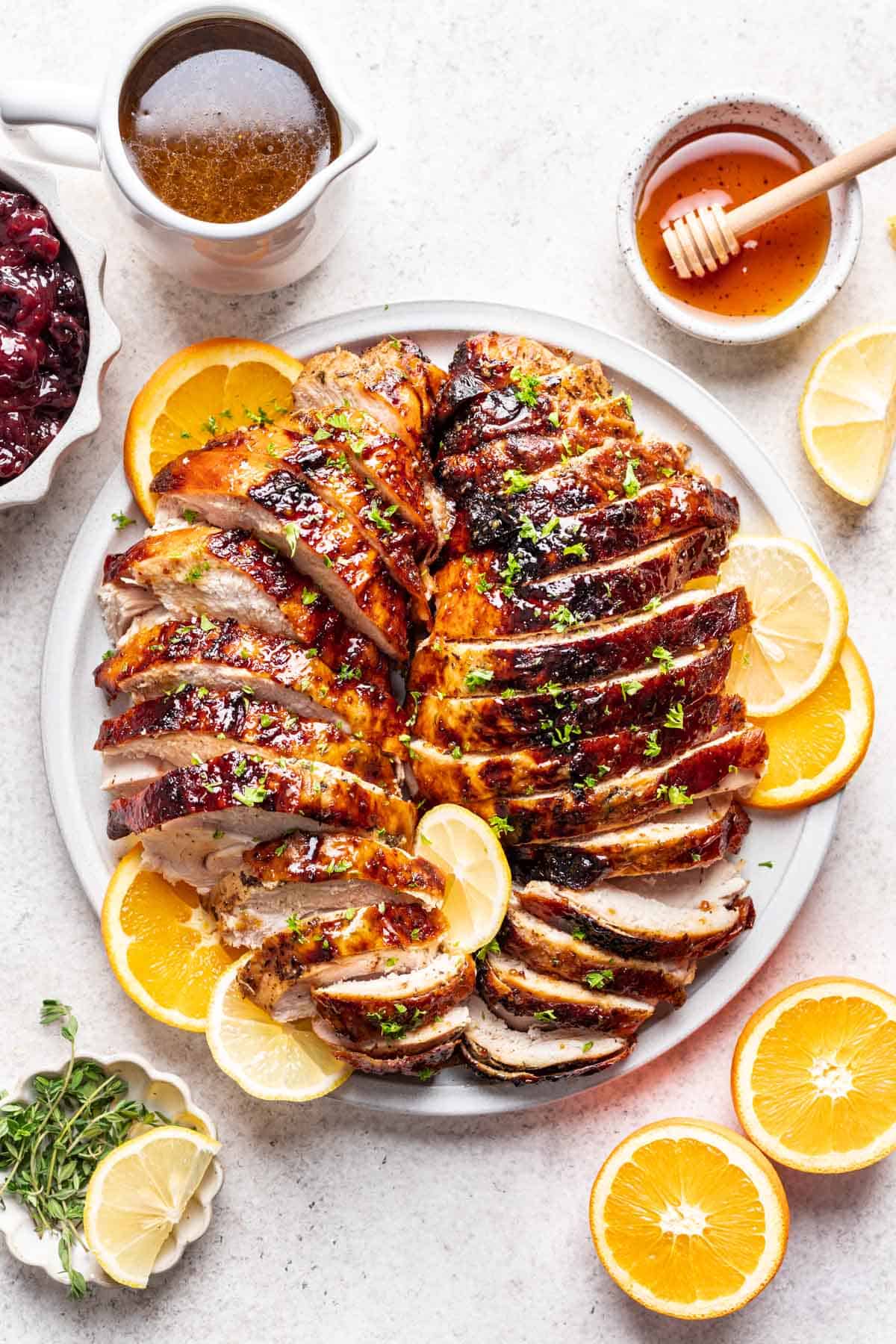 Sliced honey baked turkey breast on a serving platter.