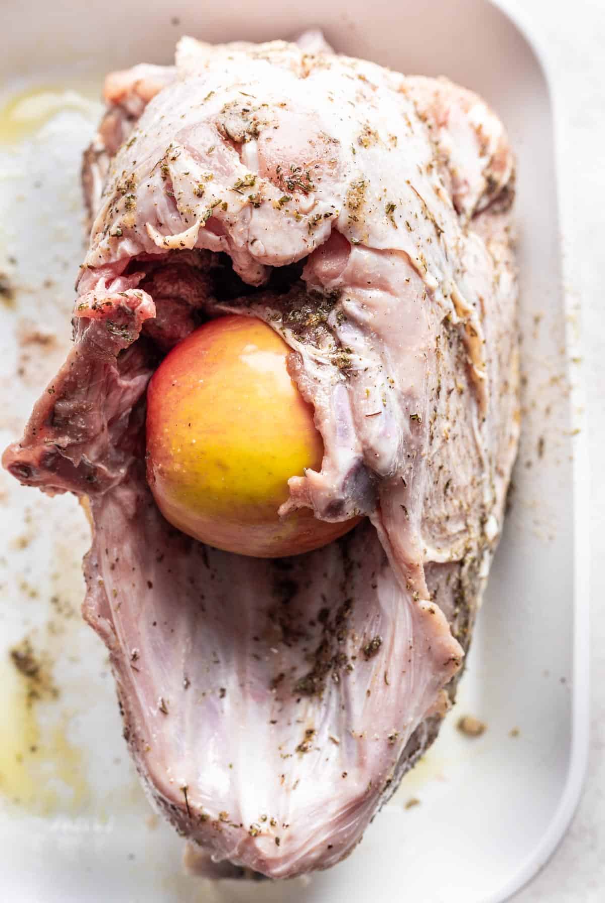 Bay leaves and apple stuffed in the turkey breast's cavity.