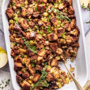 Challah bread stuffing in a white baking dish.