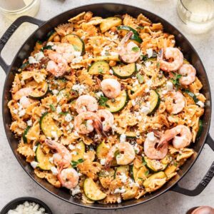 Shrimp and sun dried tomato pasta in a large skillet.