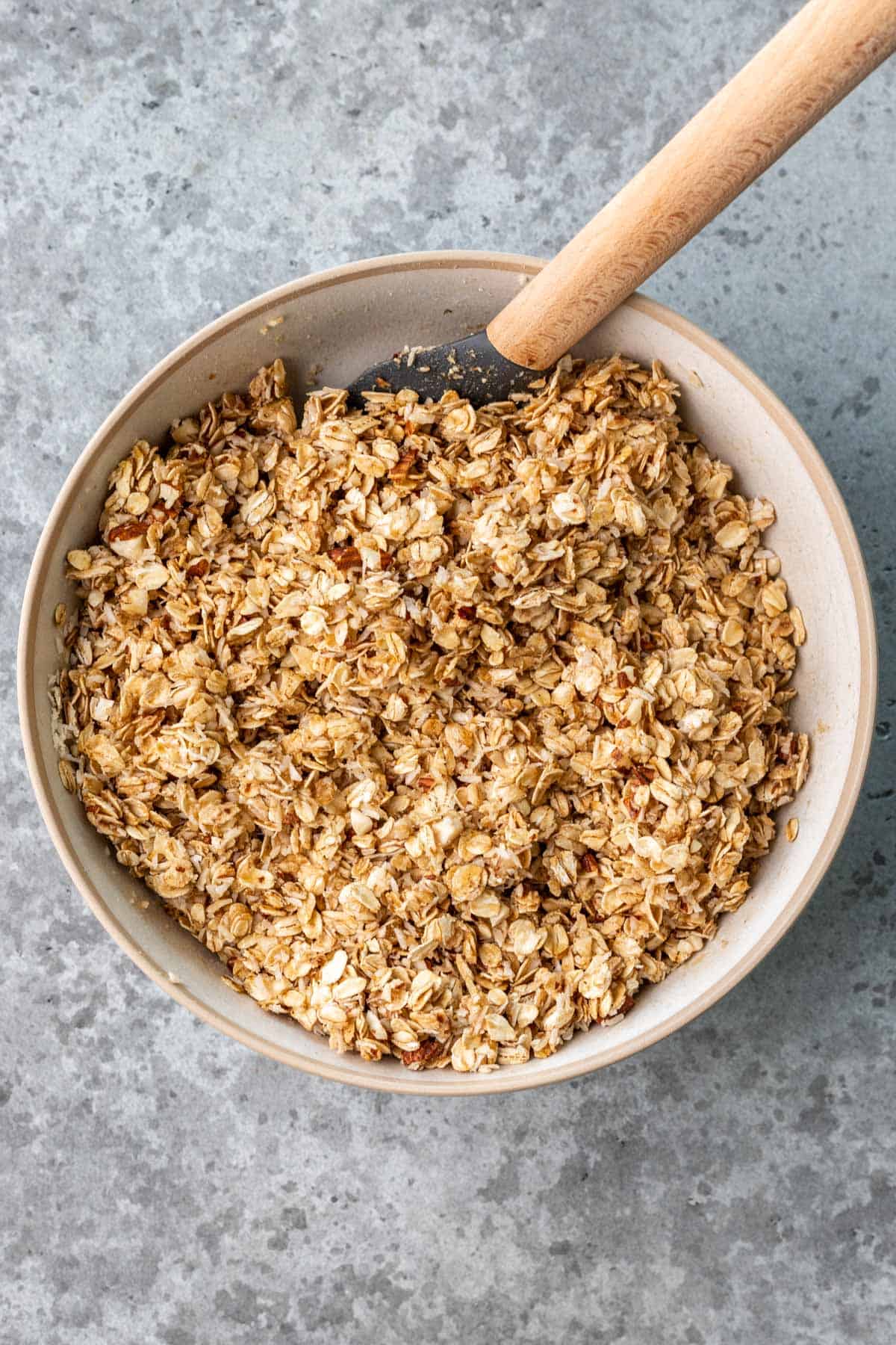 All ingredients, besides yogurt and berries, mixed together in a large bowl.