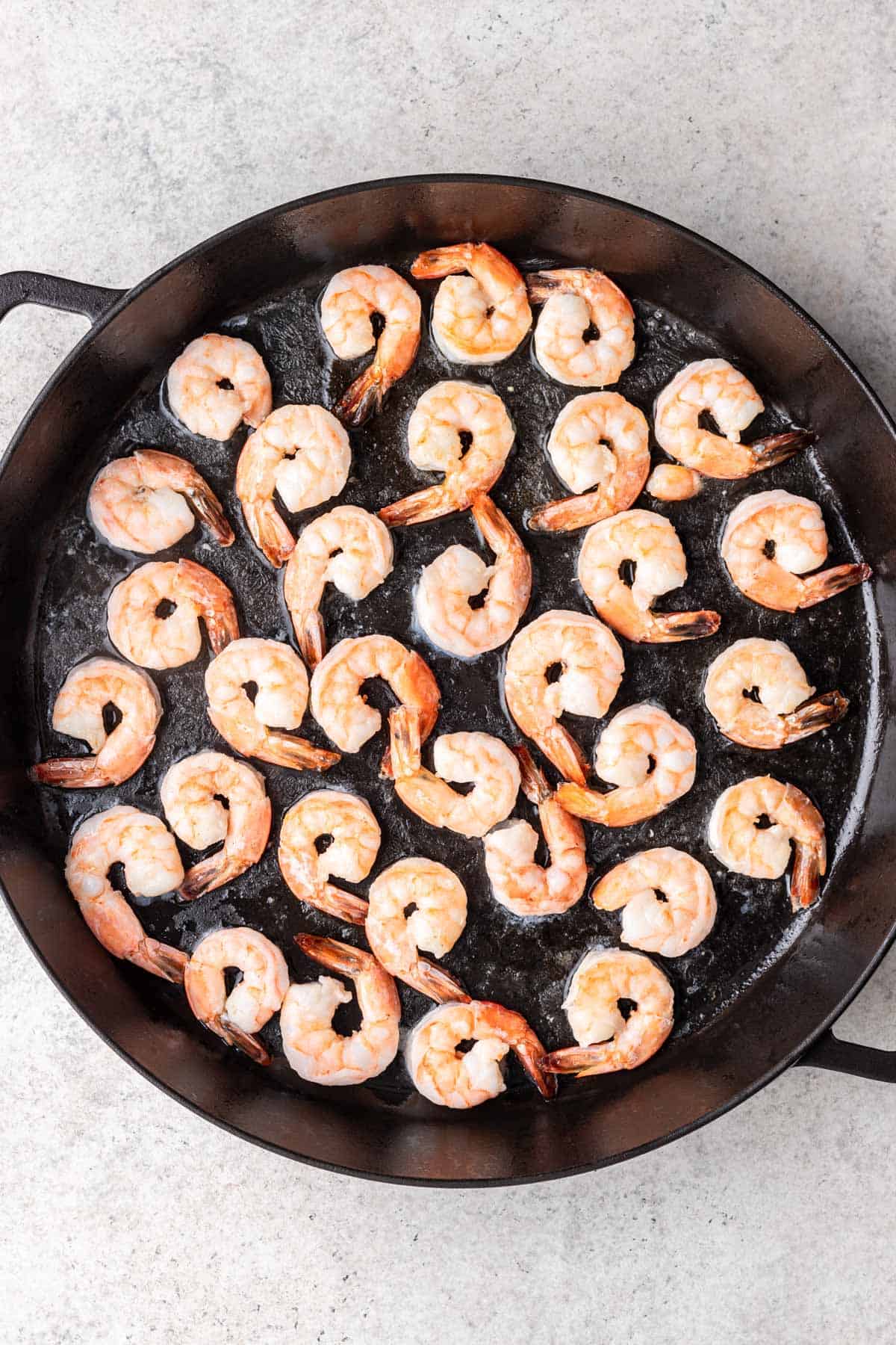 Shrimp cooked in a skillet.
