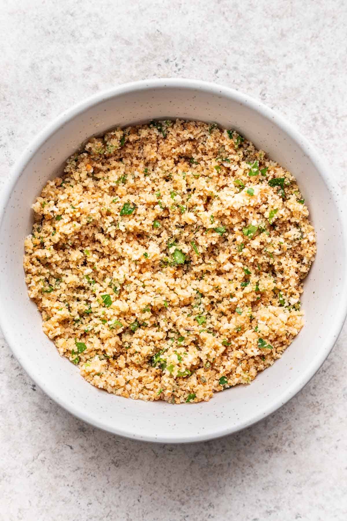 Breadcrumbs and seasonings mixed together in a bowl.