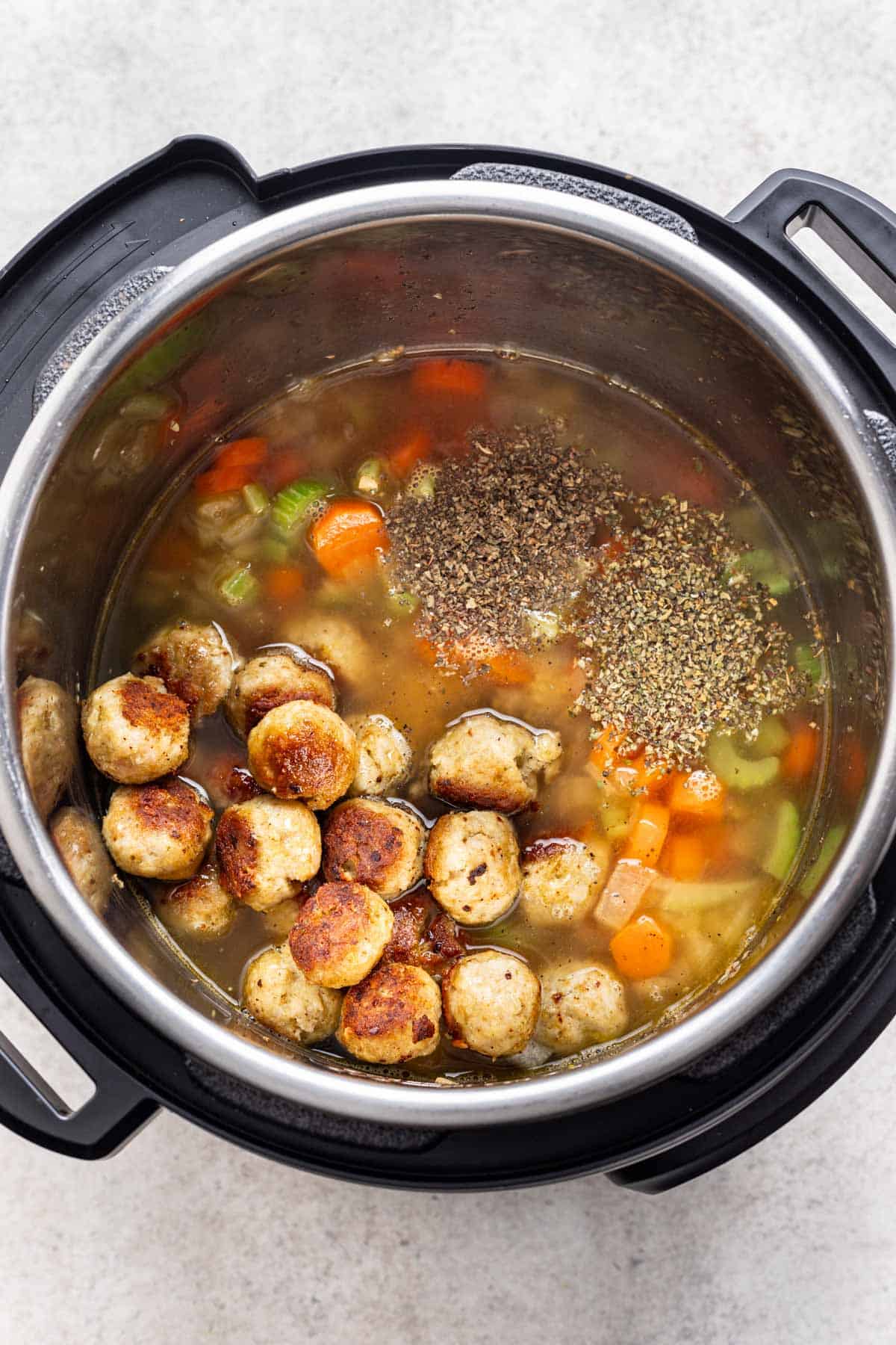 Meatballs, broth, and seasonings added back into the instant pot.