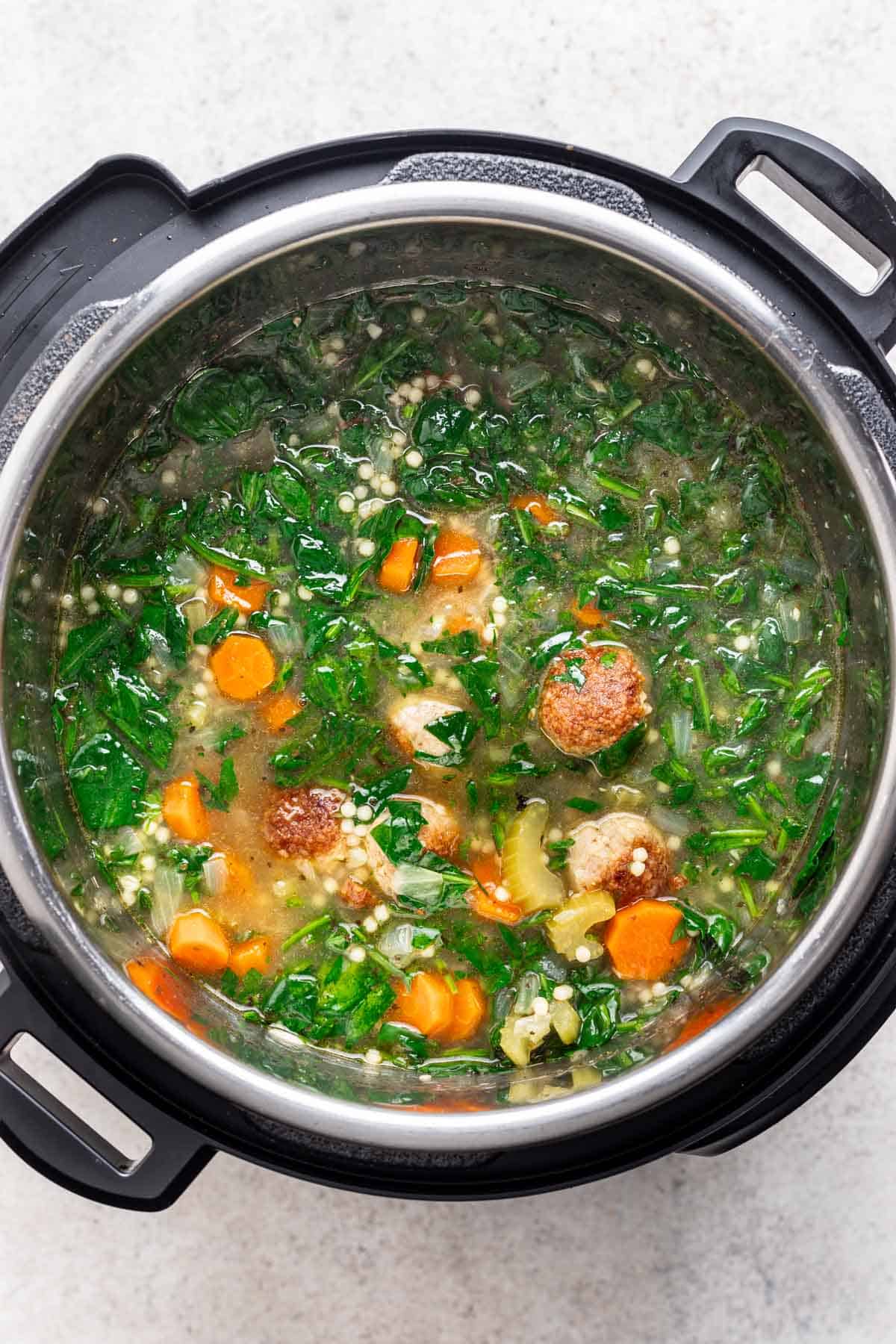 Spinach and parmesan cheese added to the instant pot.