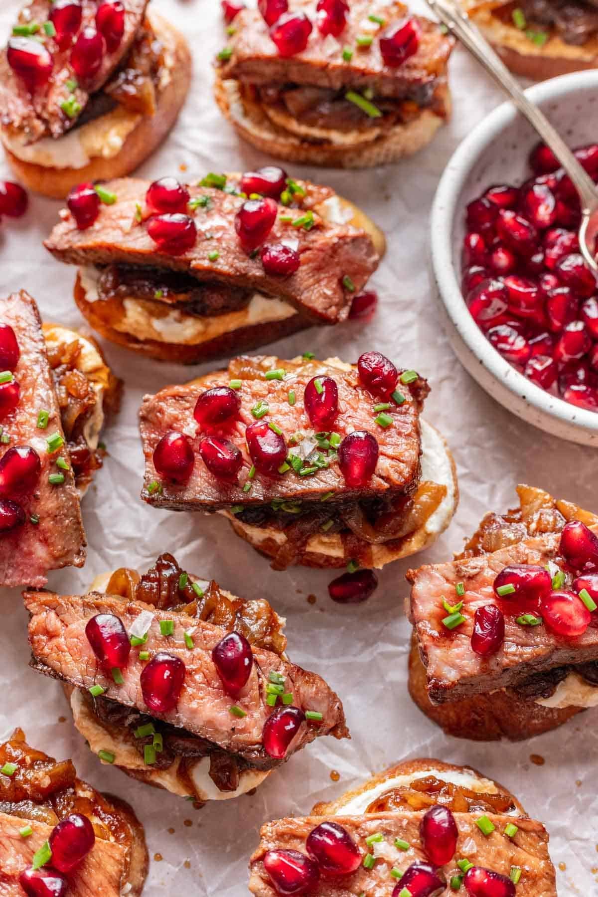 Steak and whipped feta crostini topped with whipped feta, caramelized onions, steak, and balsamic glaze.