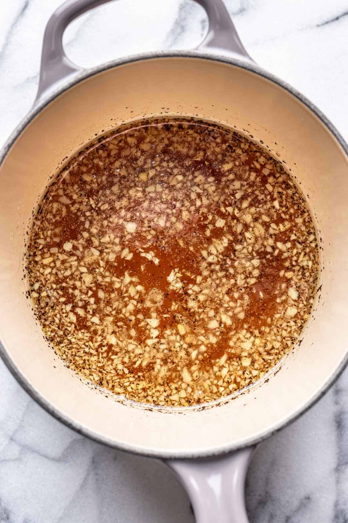 Dressing for cowboy caviar in a saucepan.