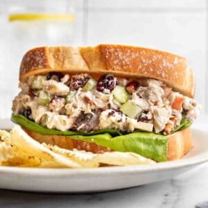 Cranberry Pecan Chicken Salad on a sandwich with crisp lettuce.