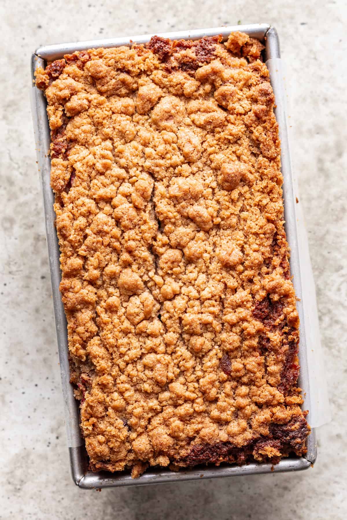 Baked cranberry apple bread in a loaf pan.