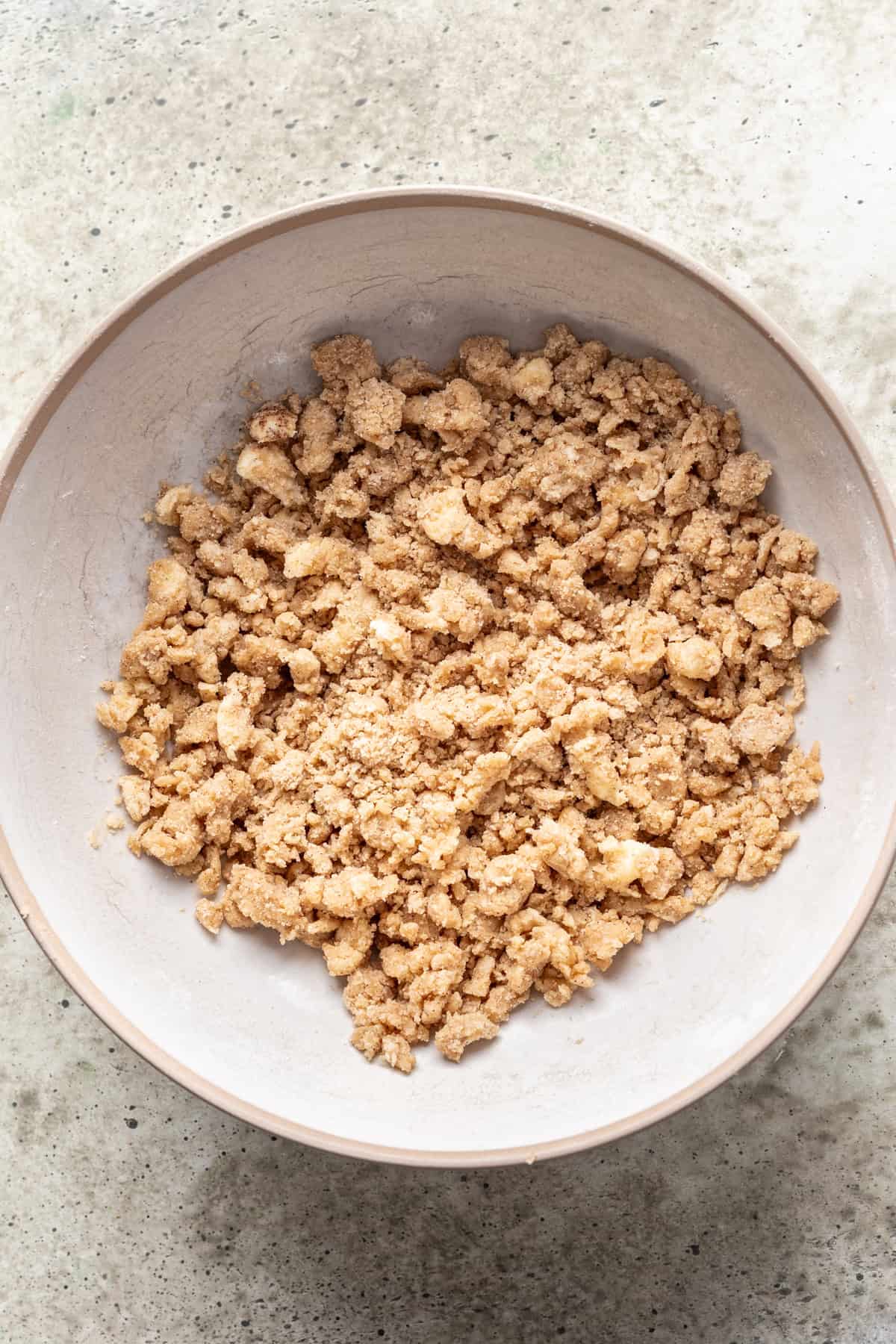 Crumble ingredients mixed together in a bowl.