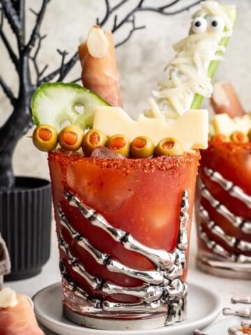 Halloween bloody mary topped with festive spooky food decorations.