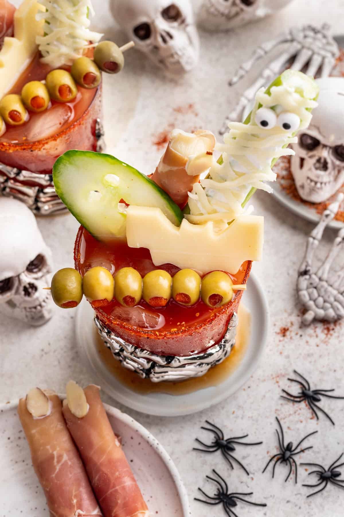 Halloween bloody mary topped with spooky edible toppings.