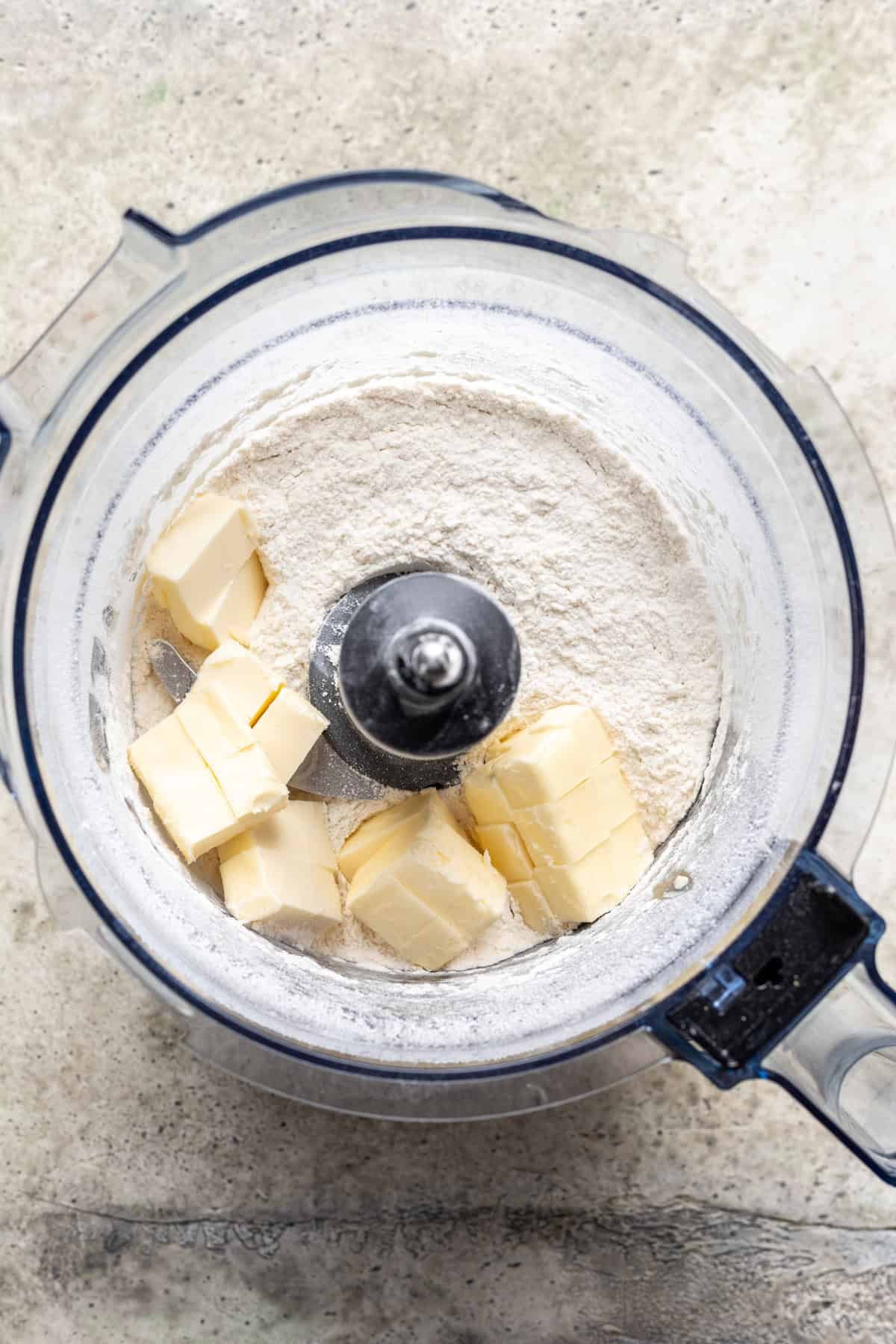 Butter added to the flour and salt in the food processor.
