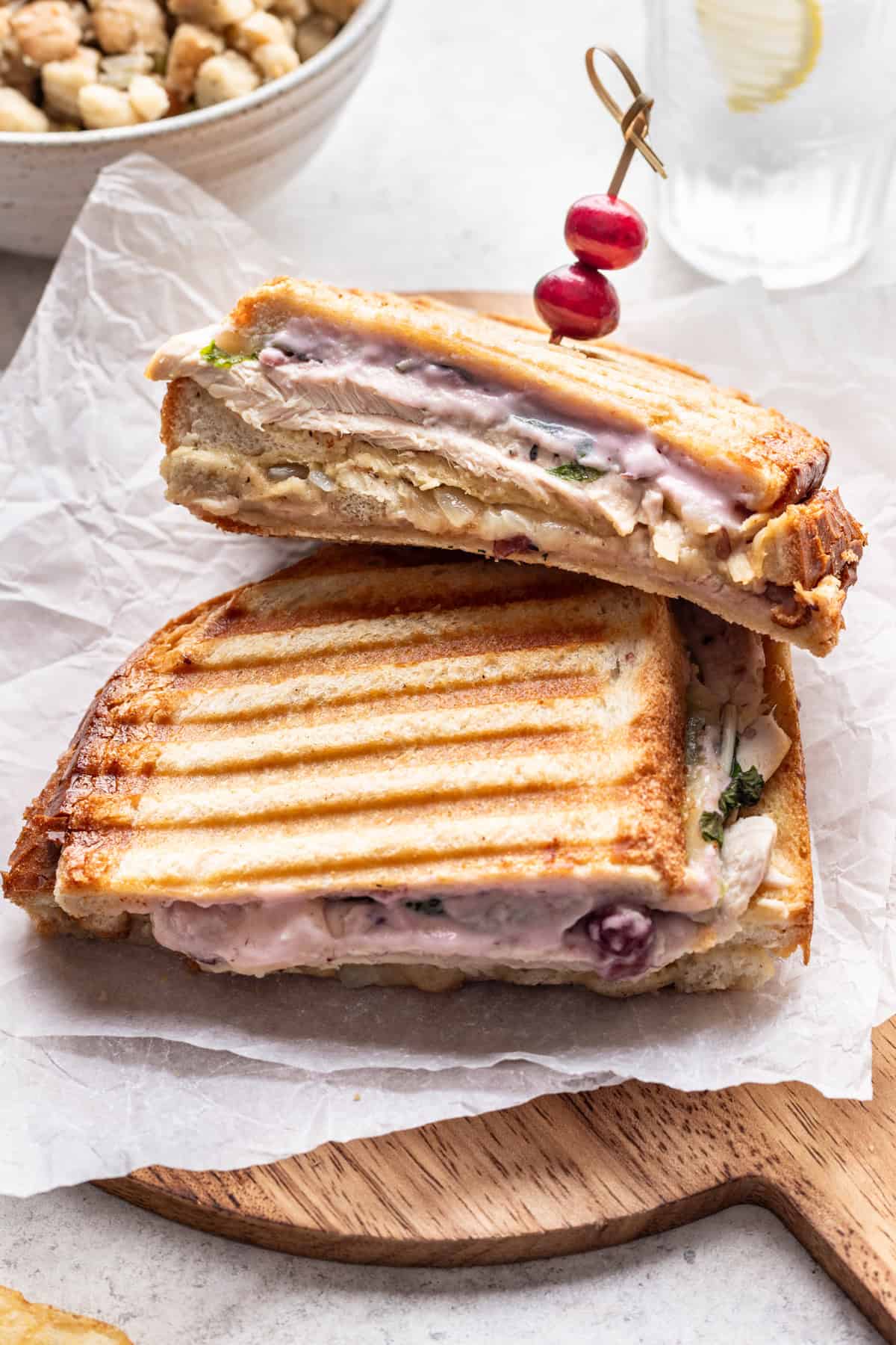 A grilled thanksgiving leftover panini on a serving board.