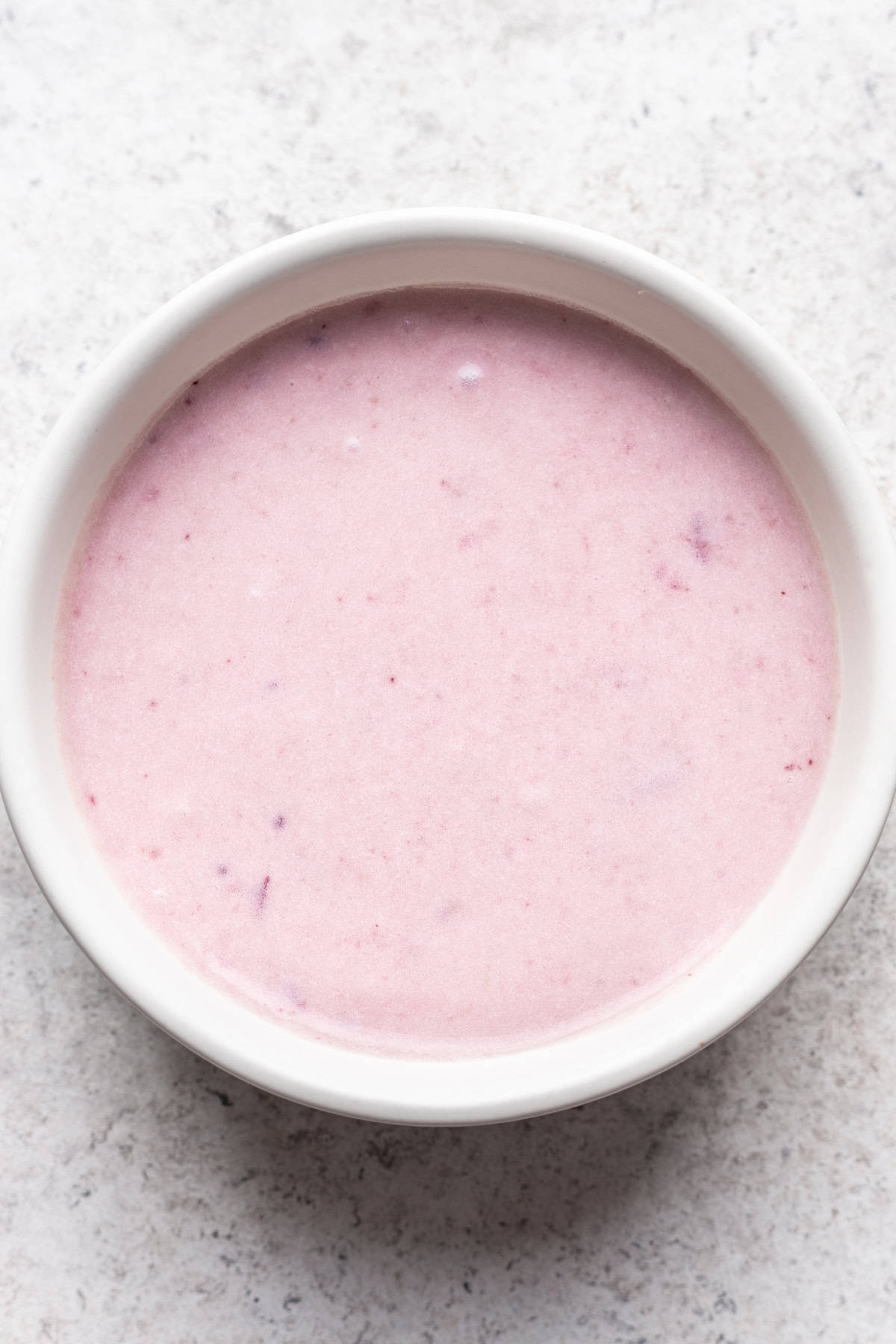 Leftover cranberry sauce, mashed potatoes, and yogurt mixed together in a bowl.
