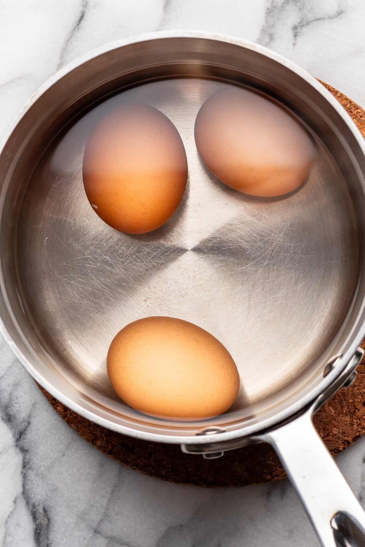 Egg boiled in a small pot.