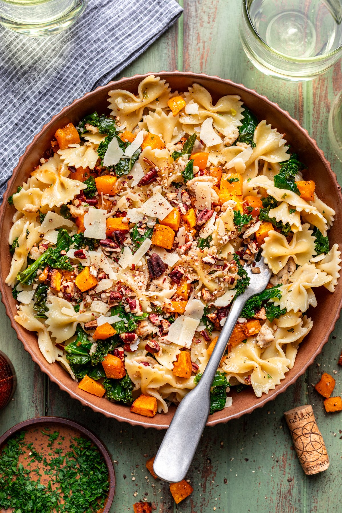 Roasted butternut squash pasta in a serving bowl with a fork.