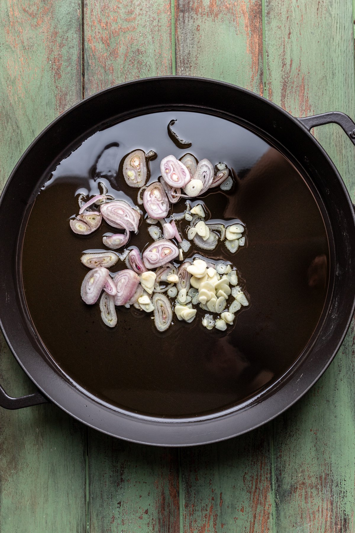 Shallot and garlic cooked in a large skillet.