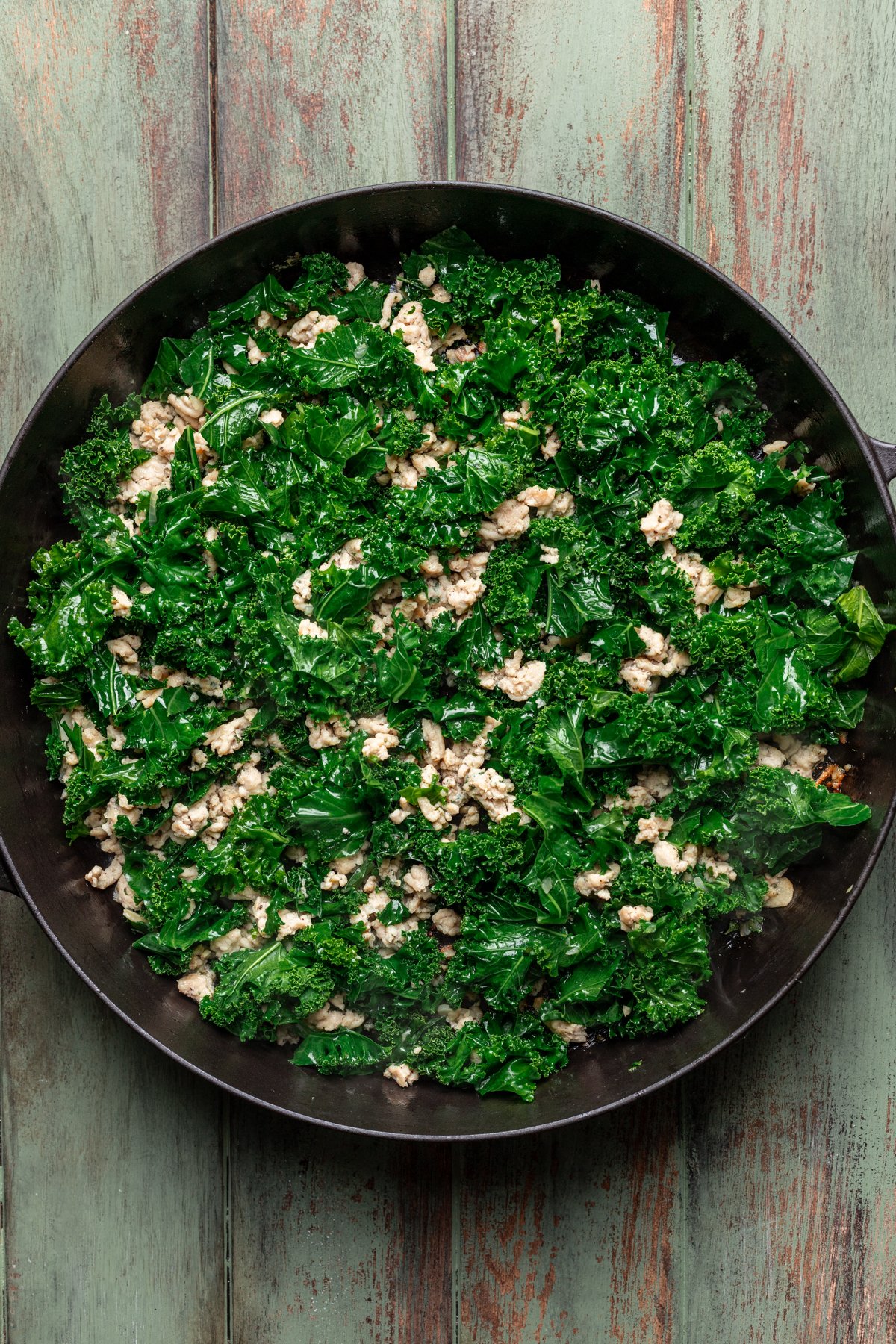 Kale added to the skillet.