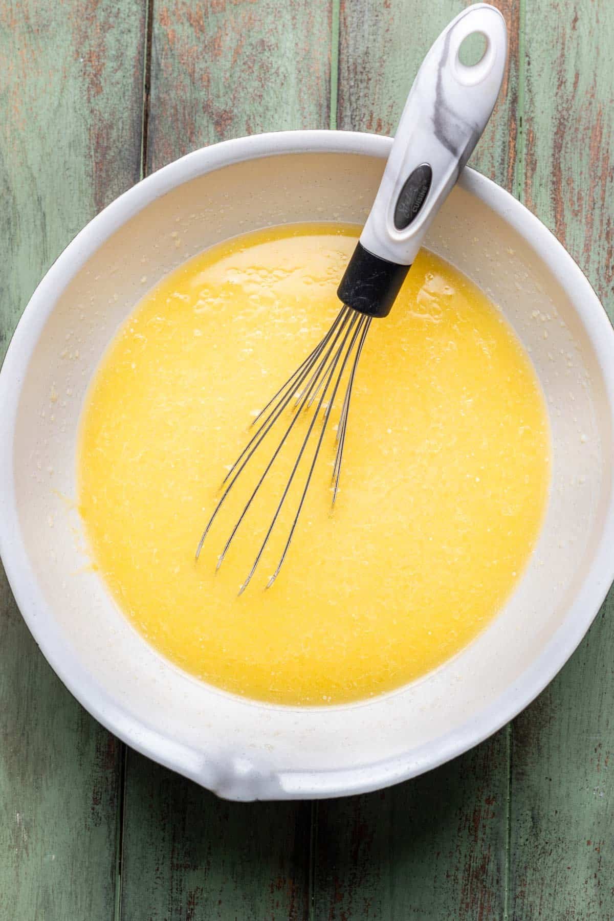 Wet ingredients whisked in a bowl.